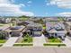 Modern two-story home featuring a well-manicured lawn, spacious driveway, and inviting curb appeal on a sunny day at 1846 Osprey Dr, Brighton, CO 80601