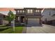 Beautiful home featuring well-manicured lawn and a two car garage at 1846 Osprey Dr, Brighton, CO 80601