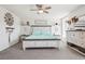 Bright main bedroom with a wooden frame bed, neutral palette, and stylish decorations at 1846 Osprey Dr, Brighton, CO 80601