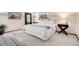 Bright bedroom with soft carpet, fresh white linens, and large window at 7290 Lamar Ct, Arvada, CO 80003