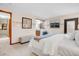 Comfortable bedroom with neutral tones, large window, and a decorative floral accent at 7290 Lamar Ct, Arvada, CO 80003