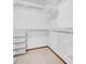 Walk-in closet with adjustable white wire shelving and a carpeted floor at 7290 Lamar Ct, Arvada, CO 80003