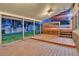 Outdoor covered patio deck perfect for entertaining, with views of a lush backyard and shed at 7290 Lamar Ct, Arvada, CO 80003