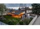 Charming home exterior features a covered deck, manicured lawn, and a fenced backyard at 7290 Lamar Ct, Arvada, CO 80003
