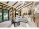 Cozy living room with vaulted ceilings, exposed beams, and fireplace access at 7290 Lamar Ct, Arvada, CO 80003