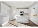 Modern kitchen with white cabinets and island at 1322 Bloom St, Brighton, CO 80601