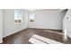 Bright living room with hardwood floors and large windows at 1322 Bloom St, Brighton, CO 80601
