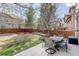 Backyard with dining seating, patio and grass, perfect for outdoor living at 4542 Valleybrook Dr, Highlands Ranch, CO 80130