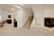Spacious finished basement with carpet flooring and a cozy fireplace at 4542 Valleybrook Dr, Highlands Ranch, CO 80130