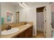 Bathroom featuring double vanity, walk in shower and mirrors at 4542 Valleybrook Dr, Highlands Ranch, CO 80130