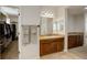 Bathroom vanity with dual sinks with plenty of cabinet space and storage, featuring a walk-in closet at 4542 Valleybrook Dr, Highlands Ranch, CO 80130