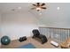 Spacious bonus room features vaulted ceiling, fitness equipment, and natural light at 4542 Valleybrook Dr, Highlands Ranch, CO 80130