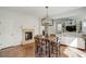 Cozy dining room and fireplace, with open view of the living room, built-ins, and lots of natural light at 4542 Valleybrook Dr, Highlands Ranch, CO 80130