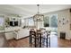Light-filled dining area open to the living room, with sliding doors to the patio and views of the backyard at 4542 Valleybrook Dr, Highlands Ranch, CO 80130