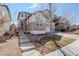 Charming two-story home featuring stone and stucco accents, a well-manicured lawn, and inviting curb appeal at 4542 Valleybrook Dr, Highlands Ranch, CO 80130