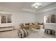 Living room with neutral tones, large windows, and comfortable seating area at 4542 Valleybrook Dr, Highlands Ranch, CO 80130