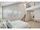Main bedroom with high ceiling, plantation shutters, and attached bathroom at 4542 Valleybrook Dr, Highlands Ranch, CO 80130