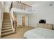 Spacious main bedroom with a vaulted ceiling, staircase, and walk-in closet at 4542 Valleybrook Dr, Highlands Ranch, CO 80130
