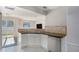 Modern kitchen boasts stainless steel appliances, a convenient double sink, and ample countertop space at 18954 E 57Th Pl # D, Denver, CO 80249