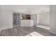 Bright living room features open access to the kitchen, creating an inviting space for gathering and entertaining at 18954 E 57Th Pl # D, Denver, CO 80249