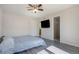 Spacious main bedroom with wood-look floors, closet, and tv; designed for relaxation and comfort at 18954 E 57Th Pl # D, Denver, CO 80249