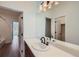 Bright bathroom featuring a mirror, vanity, and dark hardware at 6391 Cristobal Pt, Parker, CO 80134