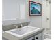 Bathroom vanity with a shower and tub combo, modern fixtures and finishes at 154 Grove St, Denver, CO 80219
