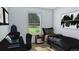 Bedroom with desk area, lots of natural light and modern decor at 154 Grove St, Denver, CO 80219