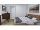 Cozy bedroom with wood floors, neutral decor, and ample natural light at 154 Grove St, Denver, CO 80219