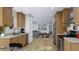 Spacious kitchen featuring wood cabinets, stainless steel appliances, and an eat in area at 154 Grove St, Denver, CO 80219