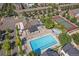 Aerial view of the community pool, tennis courts, clubhouse, and residential buildings at 4108 W 118Th Pl, Westminster, CO 80031