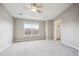 Large bedroom with a ceiling fan, carpeted floor, and ample natural light from the window at 4108 W 118Th Pl, Westminster, CO 80031