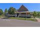 Charming clubhouse exterior with a welcoming front porch and ample parking at 4108 W 118Th Pl, Westminster, CO 80031
