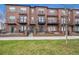 Charming brick townhomes with private balconies and manicured front yards offer an inviting curb appeal at 4108 W 118Th Pl, Westminster, CO 80031