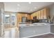 Updated kitchen features stainless steel appliances, light wood cabinets, and a breakfast bar at 4108 W 118Th Pl, Westminster, CO 80031