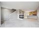 Open floor plan showcases modern fireplace and updated kitchen area with stainless appliances at 4108 W 118Th Pl, Westminster, CO 80031