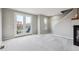 Bright living room with balcony access through double doors and a modern fireplace at 4108 W 118Th Pl, Westminster, CO 80031