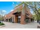 Retail space showcasing a brick exterior, awnings, a concrete sidewalk, and street parking at 4108 W 118Th Pl, Westminster, CO 80031