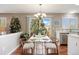 Dining area with modern table set and chandelier, conveniently open to the kitchen at 20293 E Progress Pl, Centennial, CO 80015