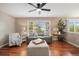 Inviting living room featuring hardwood floors, a ceiling fan, and lots of natural light at 20293 E Progress Pl, Centennial, CO 80015