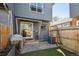 Cozy backyard featuring a patio, artificial grass, privacy fence, and a gas grill at 5415 S Delaware St, Littleton, CO 80120