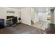 Finished basement featuring neutral walls, wood flooring, and carpeted floor at 5415 S Delaware St, Littleton, CO 80120