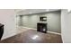 Finished basement space featuring carpeted floors, dark wood furniture, and light-green painted walls at 5415 S Delaware St, Littleton, CO 80120