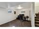 Finished basement space featuring a carpeted floor, a small window, and painted walls at 5415 S Delaware St, Littleton, CO 80120