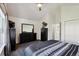 Bedroom boasts natural light, closet, neutral walls, and dark furnishings at 5415 S Delaware St, Littleton, CO 80120