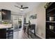 Bright eat-in kitchen with modern appliances, sleek cabinetry, and convenient access to the backyard at 5415 S Delaware St, Littleton, CO 80120