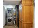 Laundry area showcasing a stacked washer and dryer and storage space at 5415 S Delaware St, Littleton, CO 80120