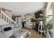 Spacious living room with a large sectional, modern shelving, and an inviting atmosphere for relaxation at 5415 S Delaware St, Littleton, CO 80120