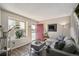 Bright living room with modern decor, including a comfortable sofa and large windows for natural light at 5415 S Delaware St, Littleton, CO 80120