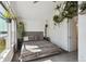 Cozy main bedroom featuring a vaulted ceiling, large window, and ample natural light at 5415 S Delaware St, Littleton, CO 80120